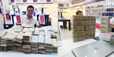 Chàng trai Việt gây sốt khi mang "núi" tiền lẻ đi mua iPhone 7 đỏ