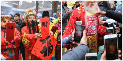 Người Trung Quốc tranh nhau nhận lì xì online bằng cách quét mã QR trên người Thần Tài