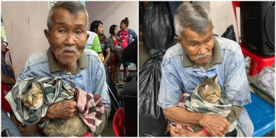 Giữa cơn bão mạnh nhất 3 thập kỉ đổ bộ Thái Lan, cụ ông ôm khư khư lấy chú mèo khiến CĐM xúc động