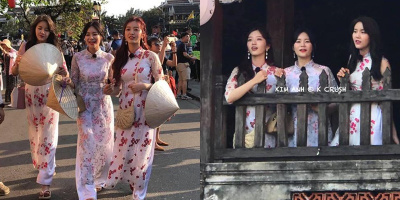 Nhóm nhạc Hàn Quốc rạng rỡ trong trang phục áo dài, sải bước trên phố cổ Hội An