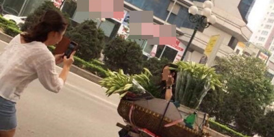 “Mượn ké” gánh hoa bán rong bên đường để sống ảo rồi bỏ đi không mua, 2 cô gái khiến CĐM tranh cãi