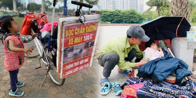 Ông bố ôm con đi bán bọc chân chống xe máy được cộng đồng giúp đỡ