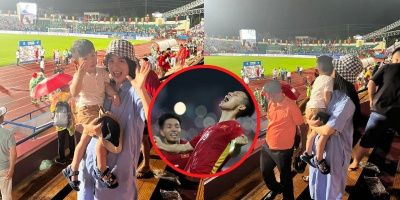 Vợ Hùng Dũng bế con ủng hộ chồng trên khán đài trận đấu U23 Việt Nam