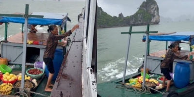 Xót xa hình ảnh người phụ nữ đội mưa bán hàng trên biển ở vịnh Hạ Long