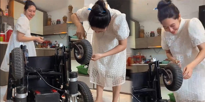 Bầu to vượt mặt, vợ chàng không chân vẫn ân cần sửa xe lăn giúp chồng