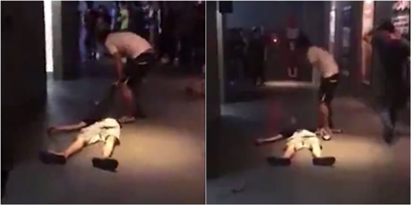 
Nam thanh niên đứng nhảy múa gào thét sau khi đã kéo lê một người bị ngất (Ảnh: chụp màn hình)
