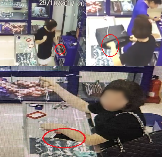 
Camera ghi lại hình ảnh cô gái trộm chiếc điện thoại của nhân viên bán hàng.