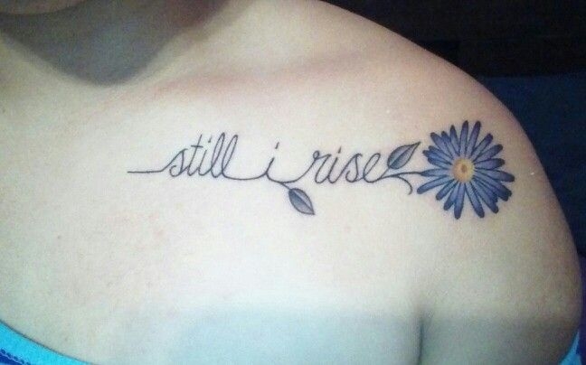 
Một cành hoa cúc kèm theo dòng chữ "Still rise"