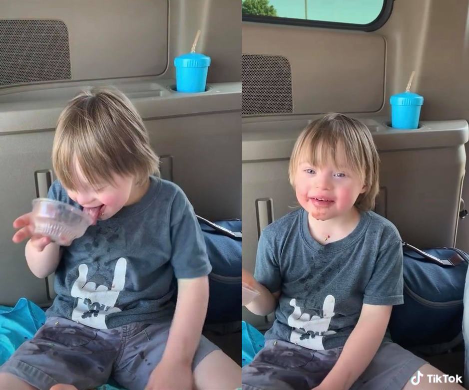  
Cậu bé thích thú ăn ly kem trong vui vẻ. (Ảnh: Chụp màn hình)