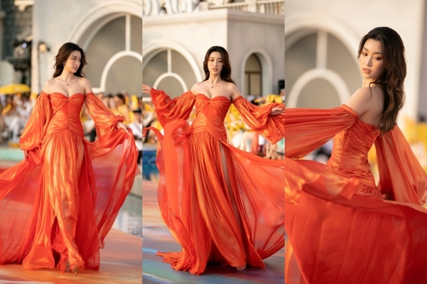  
Show diễn kết thúc bởi màn catwalk đầy thần thái của Hoa hậu Đỗ Mỹ Linh, người đẹp trở thành tâm điểm chú ý vì vẻ đẹp gợi cảm trong trang phục tông đỏ cam bắt mắt. 