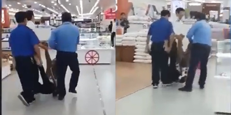  
Hình ảnh người phụ nữ bị ba nhân viên bảo viên cưỡng chế khiêng ra bên ngoài siêu thị. (Ảnh: Chụp màn hình)