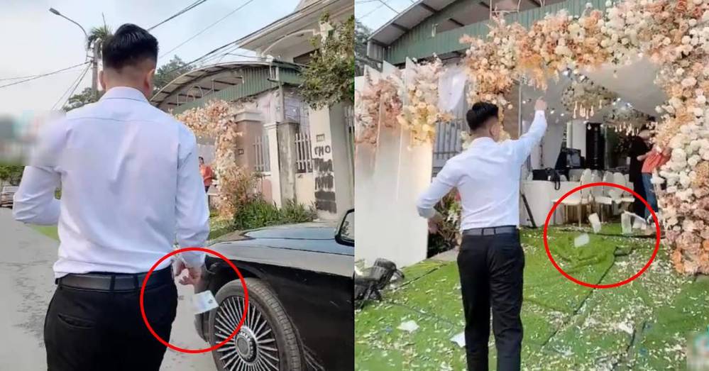  
Anh ta thả tiền từ xe cho đến tận cửa nhà cô dâu. (Ảnh cắt từ clip)