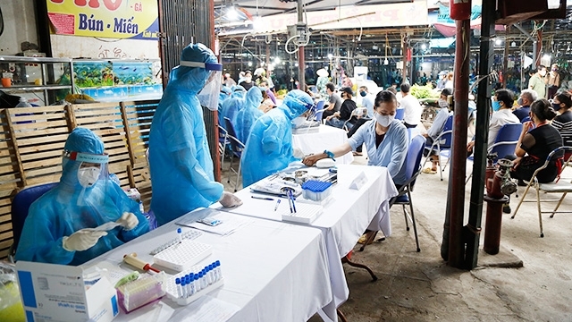 Công tác phòng dịch tại Việt Nam. (Ảnh: Nhân Dân)