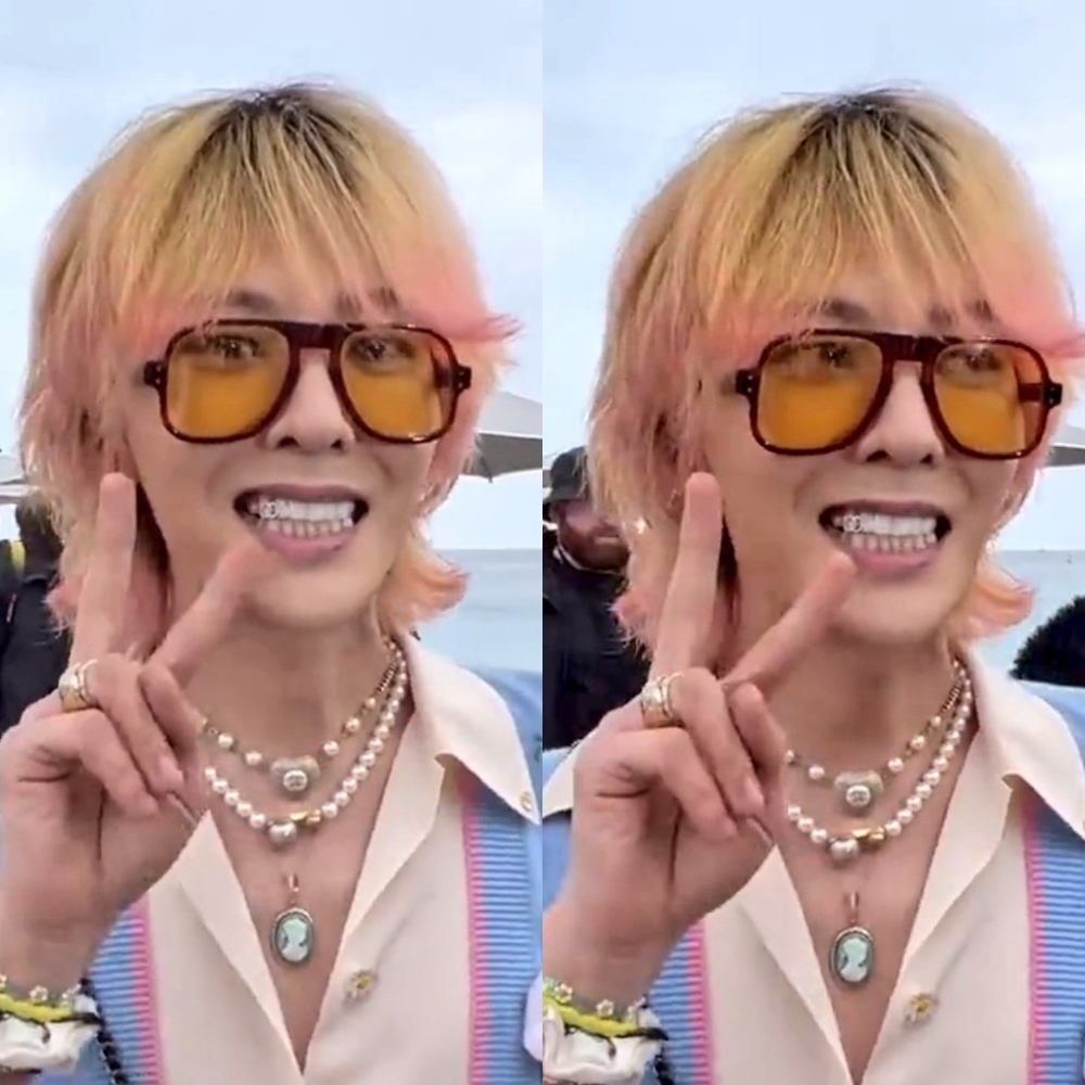  G-Dragon mang "khuyên răng" hình logo nhà mốt Chanel. (Ảnh: Twitter @vipkonics)