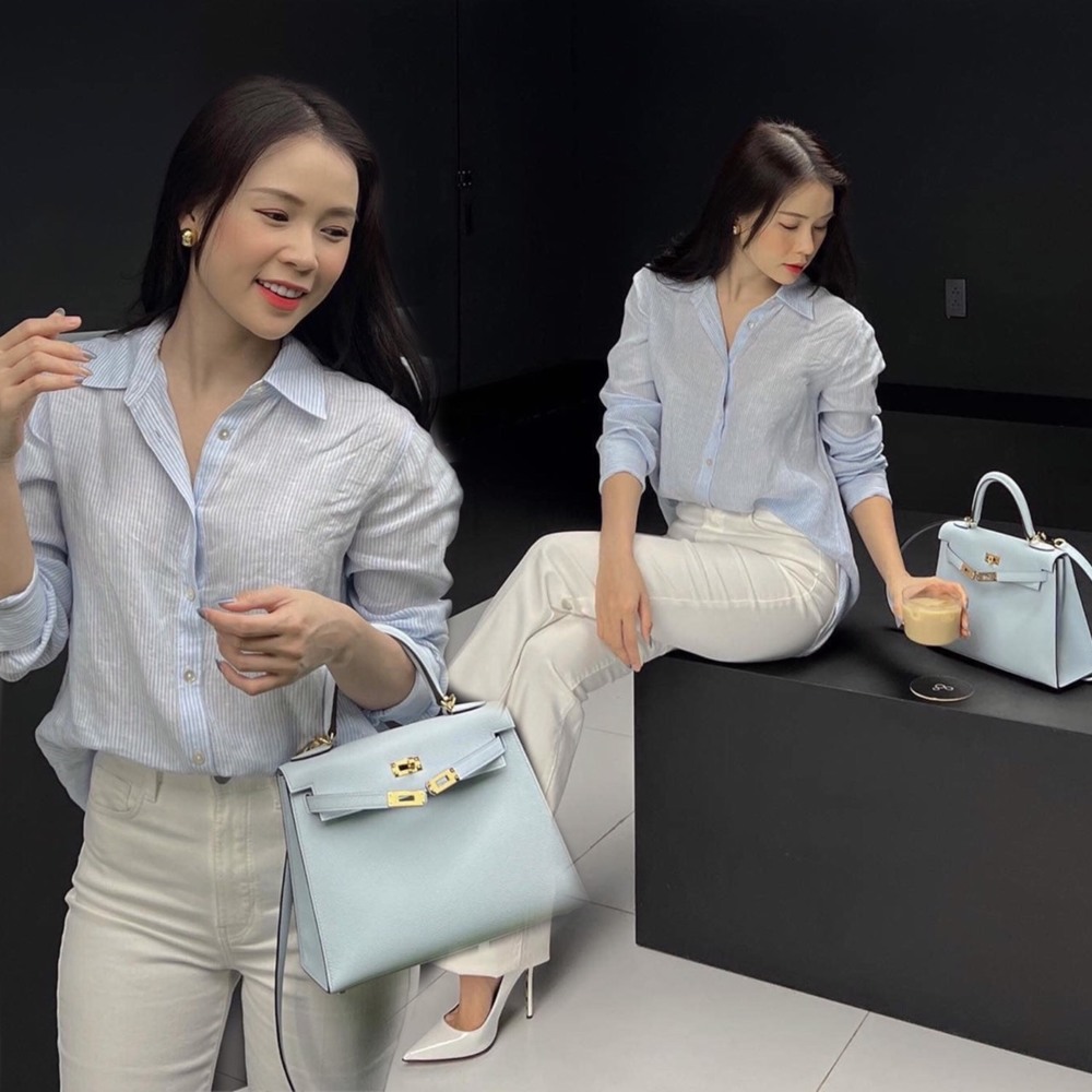 Theo đuổi phong cách thời trang thanh lịch, Sam được khen khéo léo khi phối set trang phục sơ mi xanh pastel, quần tây trắng với túi xách Hermes đồng màu áo. (Ảnh: FB Sam)