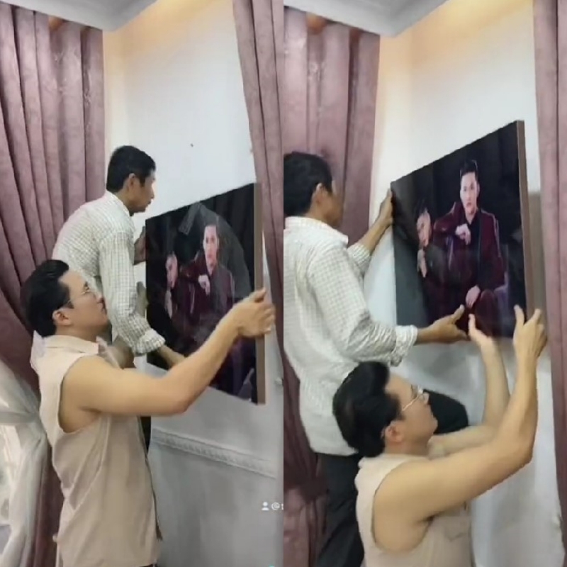 Không những thế, phụ huynh còn giúp cặp đôi treo "ảnh cưới". (Ảnh: Chụp màn hình TikTok @thanhdoanshop)
Không những thế, phụ huynh còn giúp cặp đôi treo "ảnh cưới". (Ảnh: Chụp màn hình TikTok @thanhdoanshop)