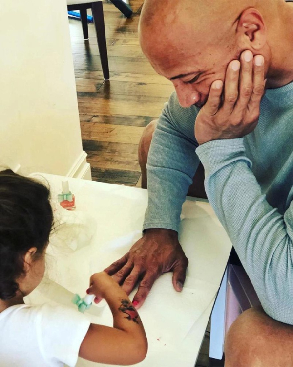  
The Rock patiently waited for her daughter to paint her nails.  (Photo: FB Dwayne The Rock Johnson)