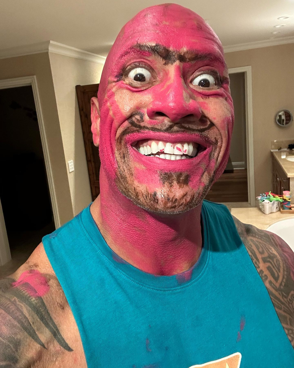  
Seeing his face dyed pink made everyone laugh.  (Ahh: FB Dwayne The Rock Johnson)