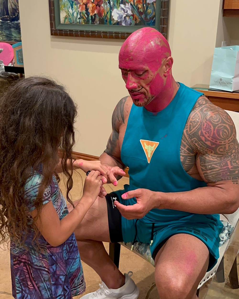  
The actor is willing to let his daughter paint her nails and dye her face pink.  (Ahh: FB Dwayne The Rock Johnson)