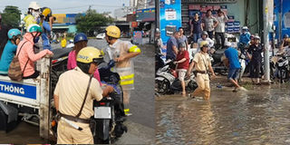 Ấm áp ngày mưa Sài Gòn: CSGT xông xáo lội nước, dùng xe chuyên dụng chở người dân qua vùng ngập