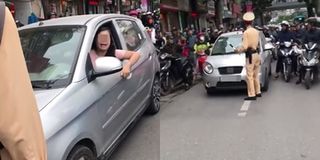 CSGT nói gì về nữ tài xế liên tục ủi xe vào cảnh sát và bảo “Đang bận, lát quay lại”?