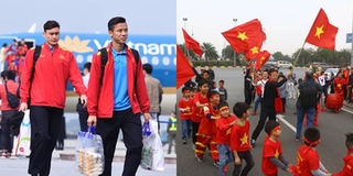 Tuyển VN về nước, người hâm mộ mang cờ hoa phủ kín sân bay chào đón những người hùng