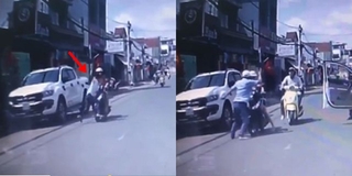 Bé trai lao ra đường va chạm xe máy, ông bố lao tới tát cô gái điều khiển xe 1 cú trời giáng
