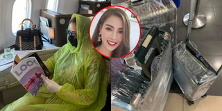 Mặc kệ bị nói "điên", Quế Vân vẫn mặc áo mưa ngồi hạng thương gia