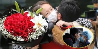 Y tá hôn bạn trai qua kính cách ly được cầu hôn trong ngày rời viện