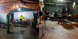 Chống bão nơi chống dịch: Chiến sĩ đu mình giữ chốt trong mưa lớn