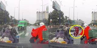 Chàng trai tặng áo mưa cho gia đình có con nhỏ ướt sũng đi trên đường